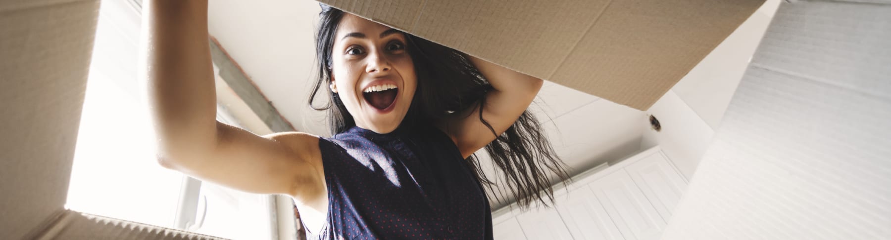 woman opening box