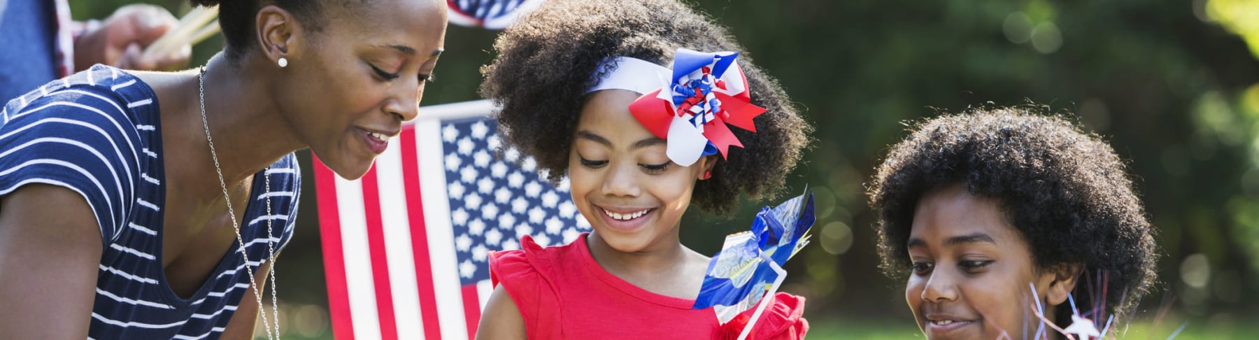 Woman and children attend patriotic picnic.