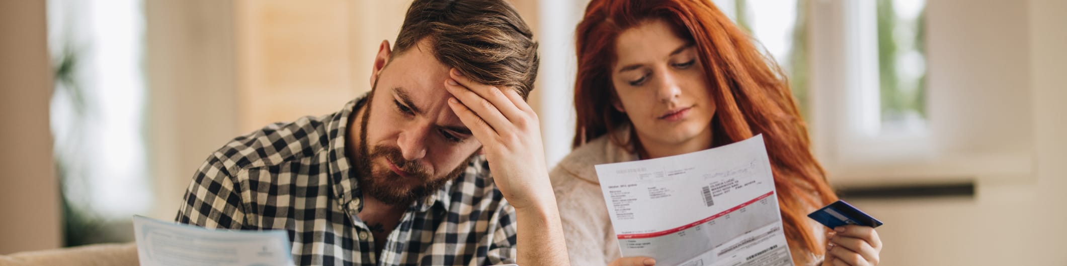 couple looking at bills