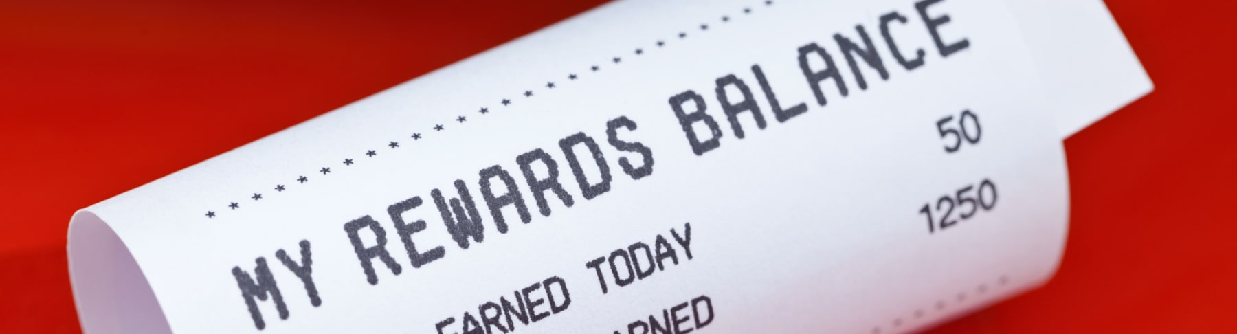 Rewards balance receipt shown on red background.
