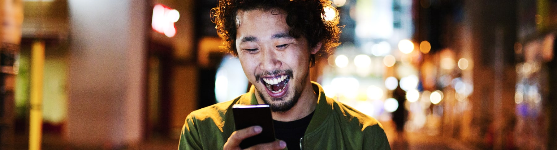 Happy man with phone.