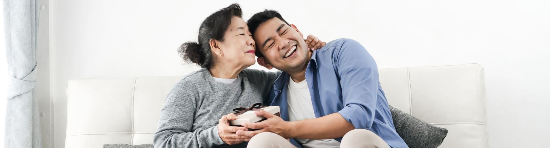 Man gives mom Mother's Day gift.