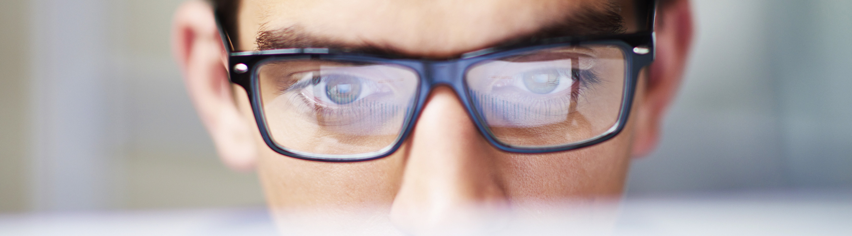man looking at computer screen