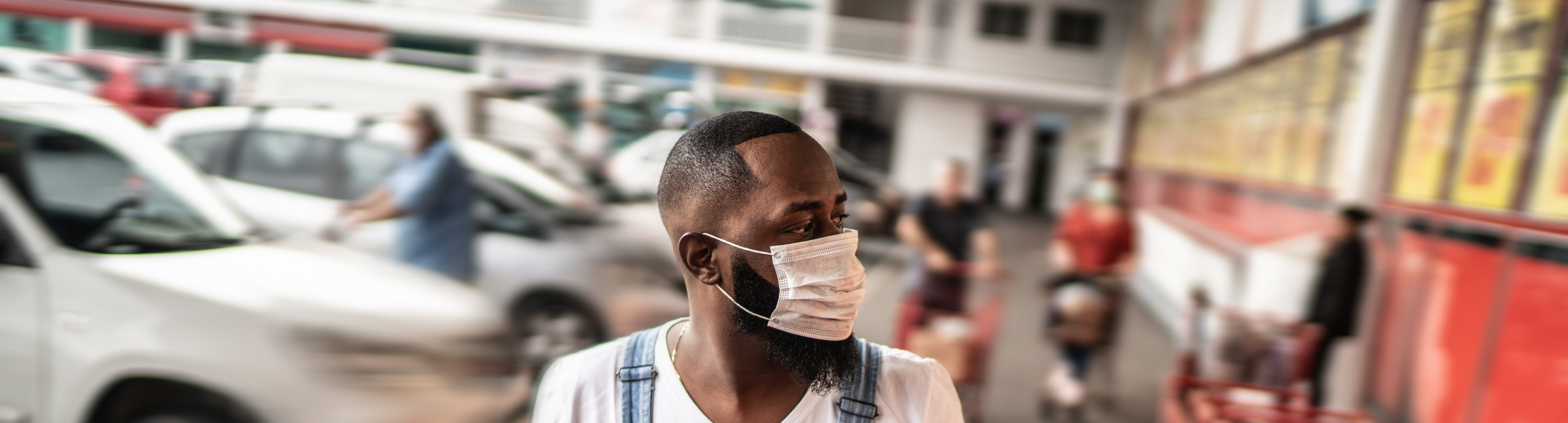 Person wearing mask and shopping