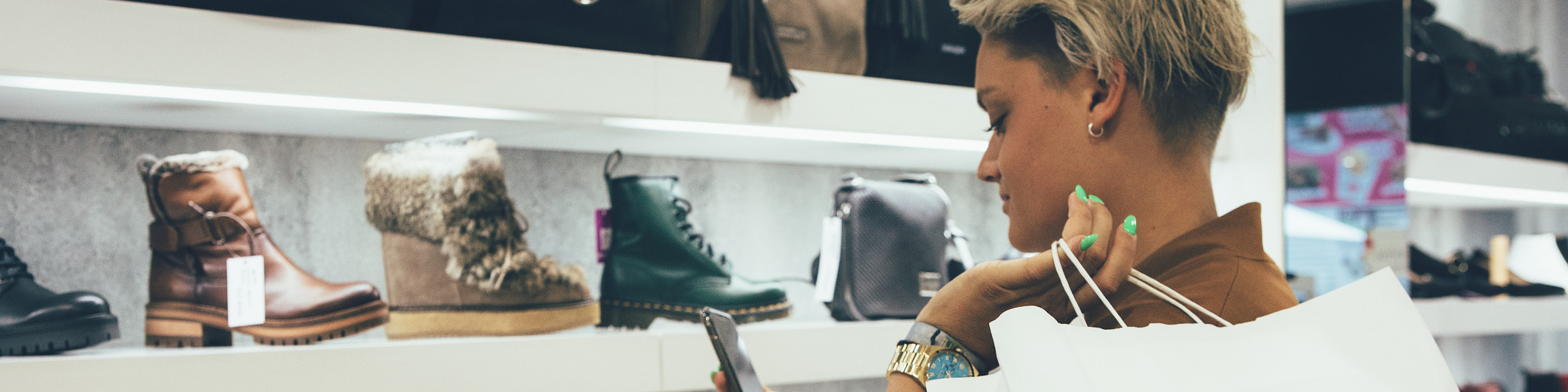 woman checking shoe price