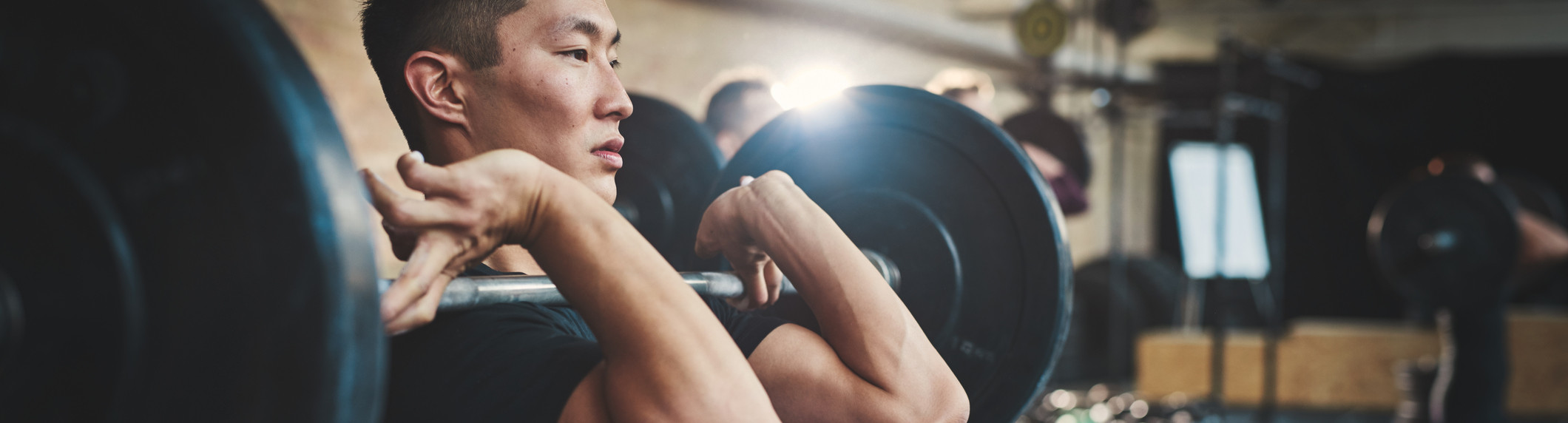 man lifting weights