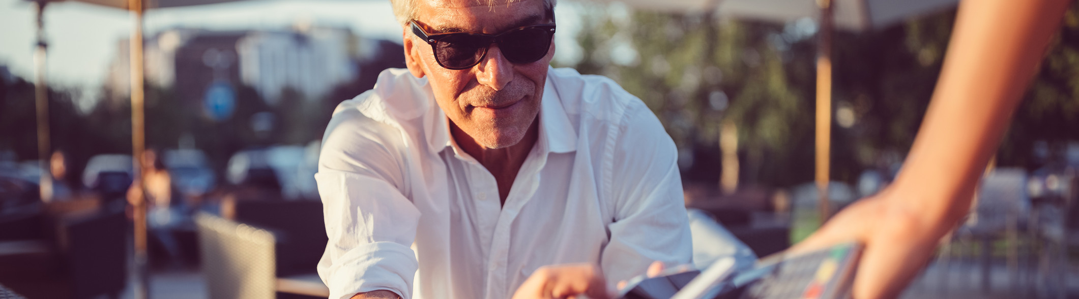 senior man using mobile payment