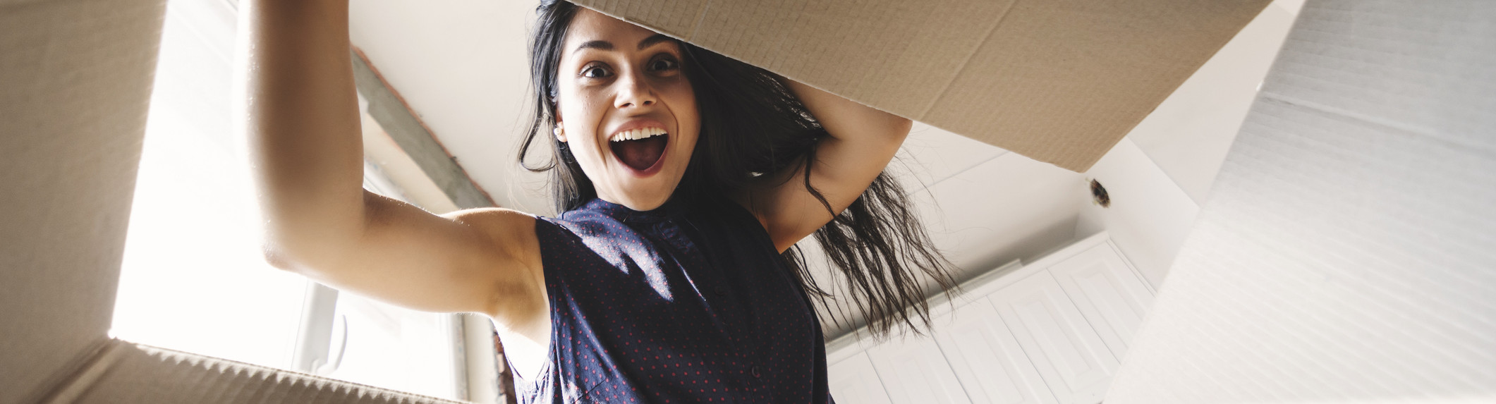 woman opening box