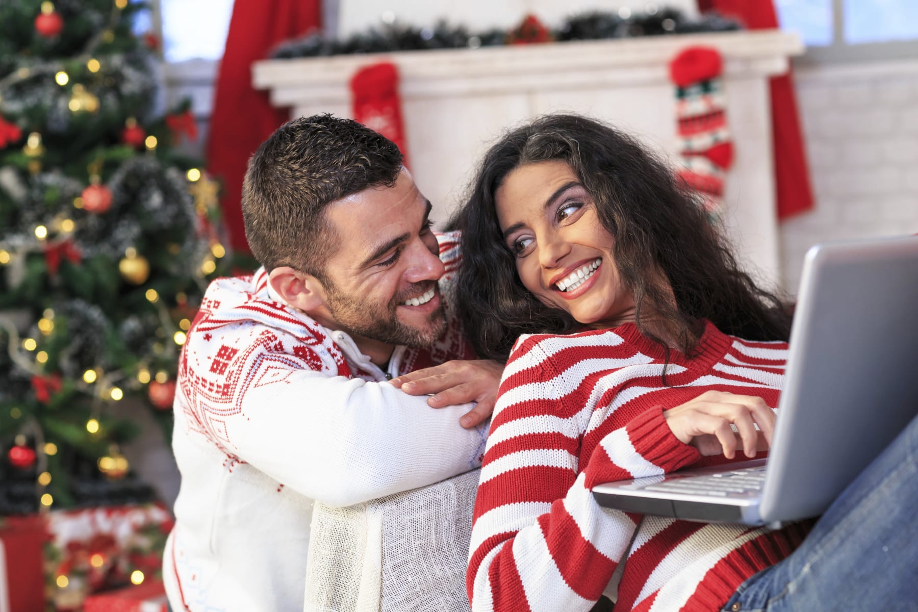 festive couple shopping online