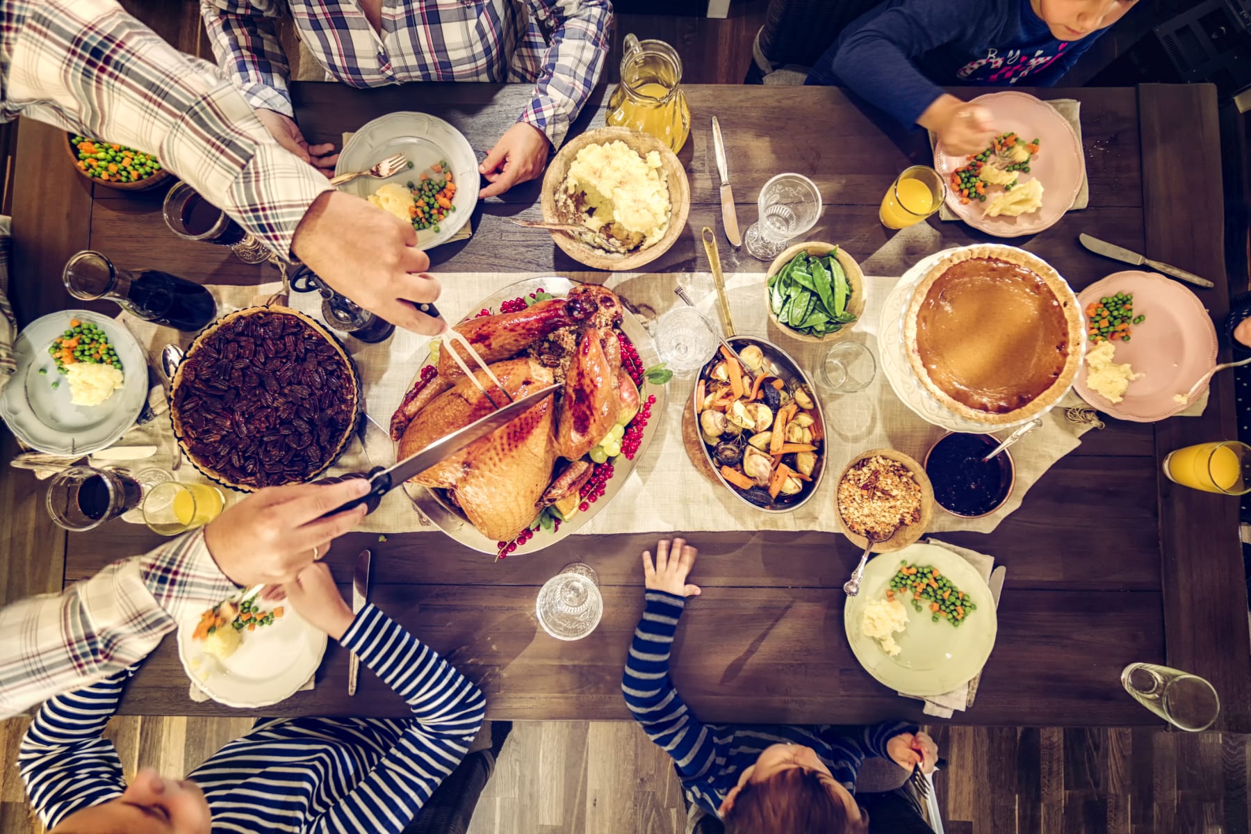 Carving Thanksgiving turkey on a table.