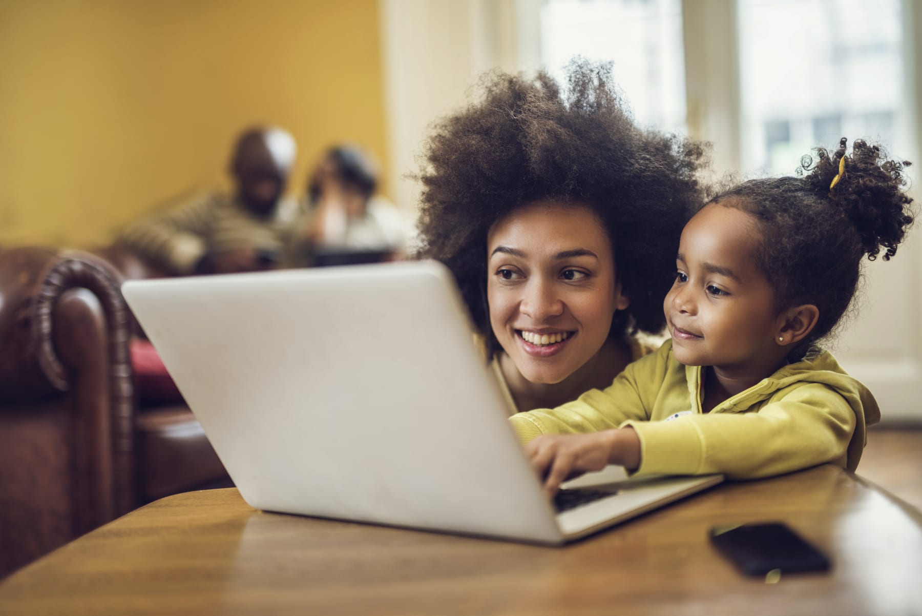 Mom and Daughter Looking at a Laptop