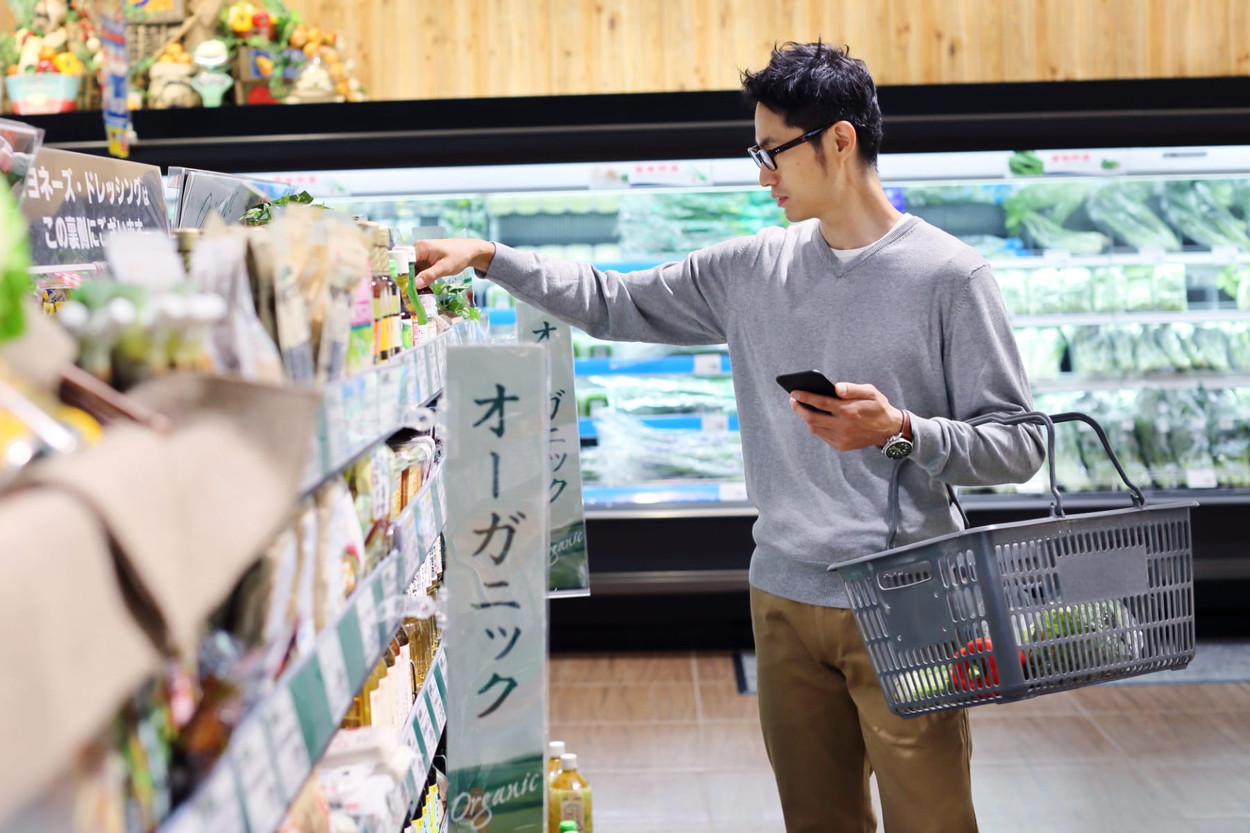 Man of Asian descent shops for groceries.
