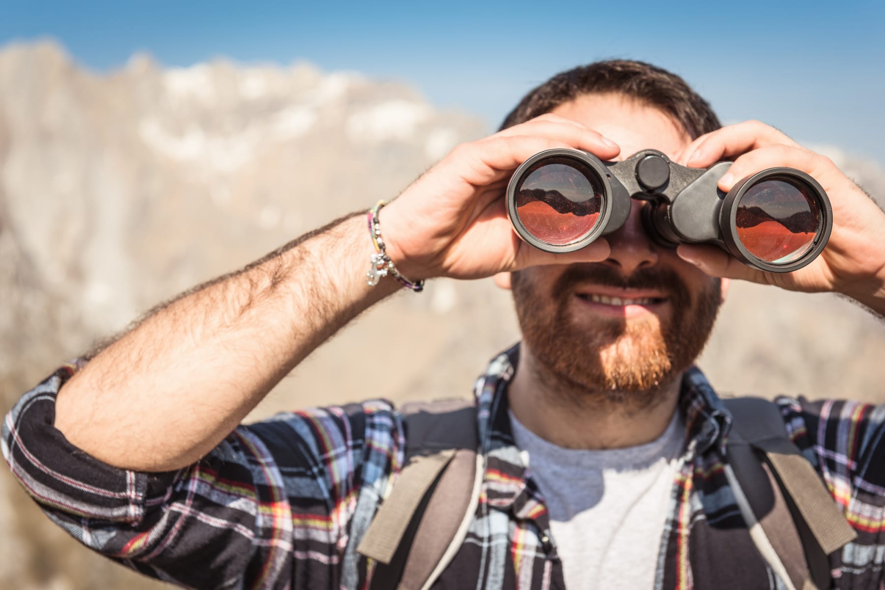 man using binoculars