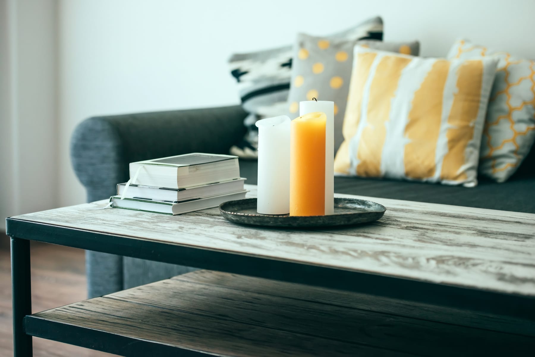 Candles sit on living room coffee table.