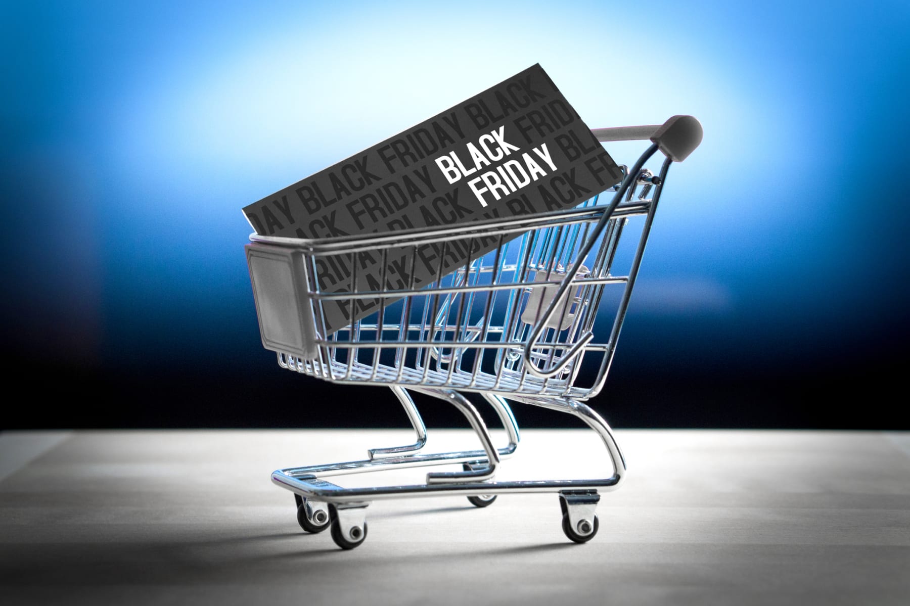 Black Friday card in a tiny shopping cart.