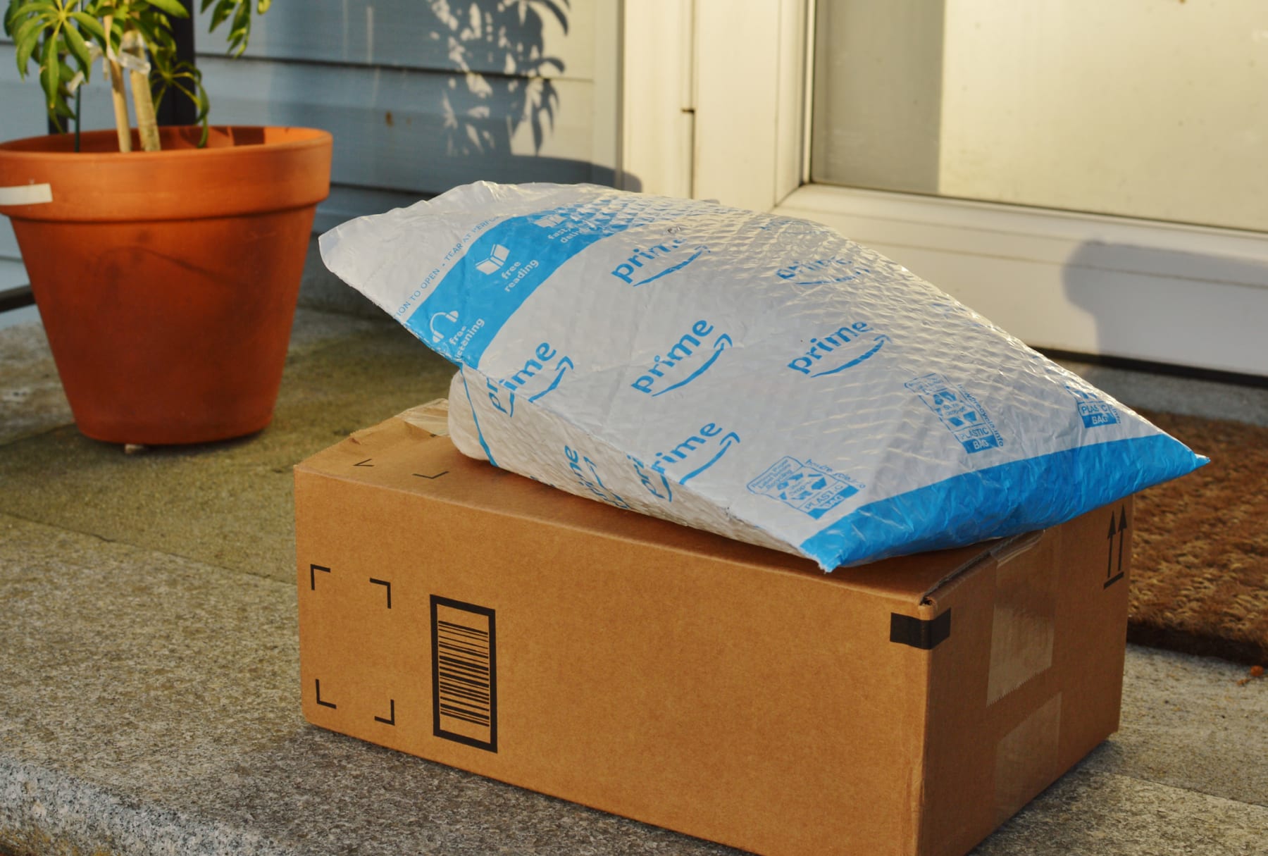 Amazon prime delivery sits on porch.