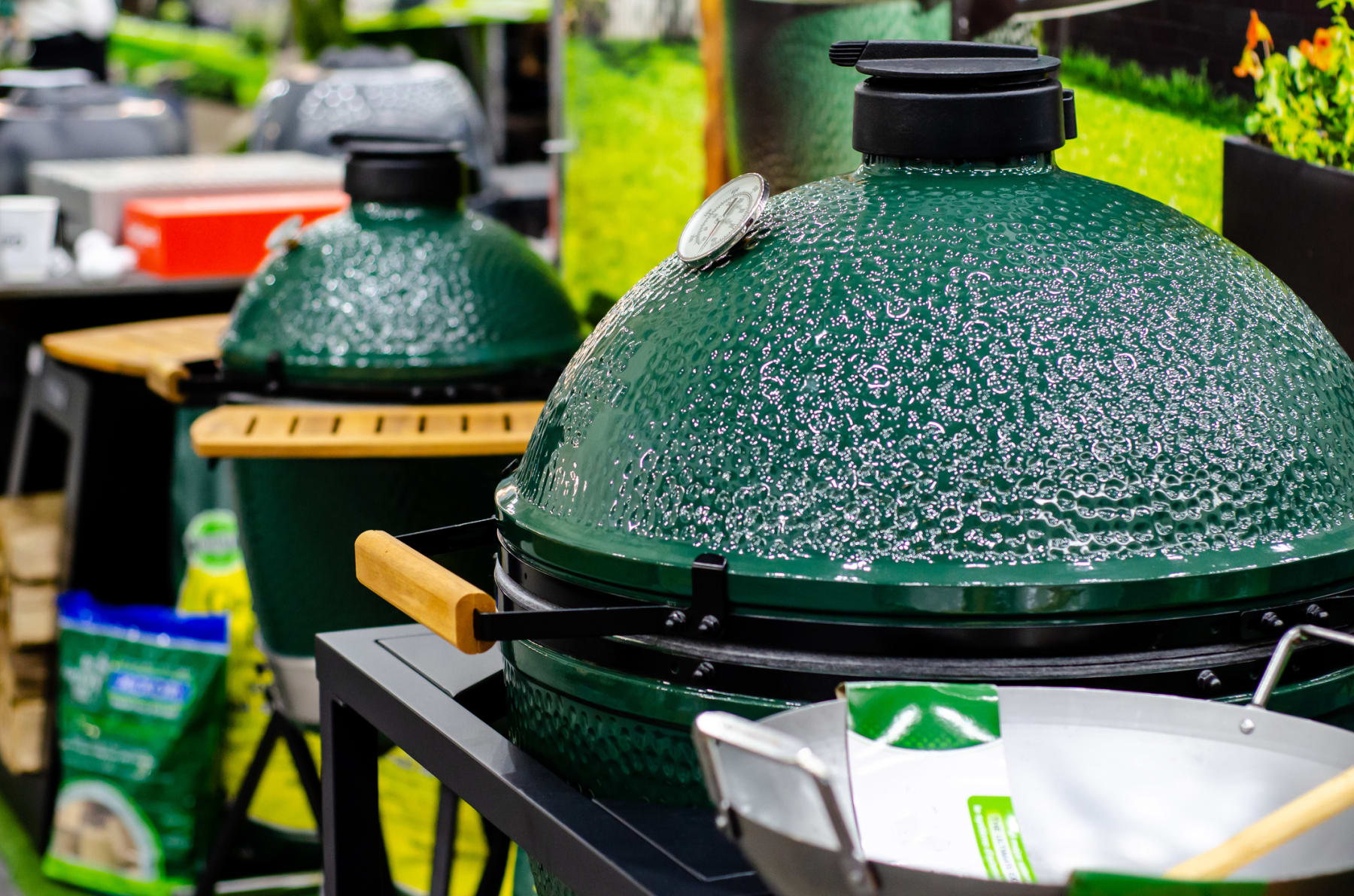 Kamado grills displayed inside store.