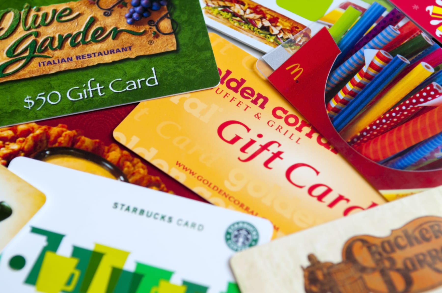 An assortment of restaurant gift cards shown together.