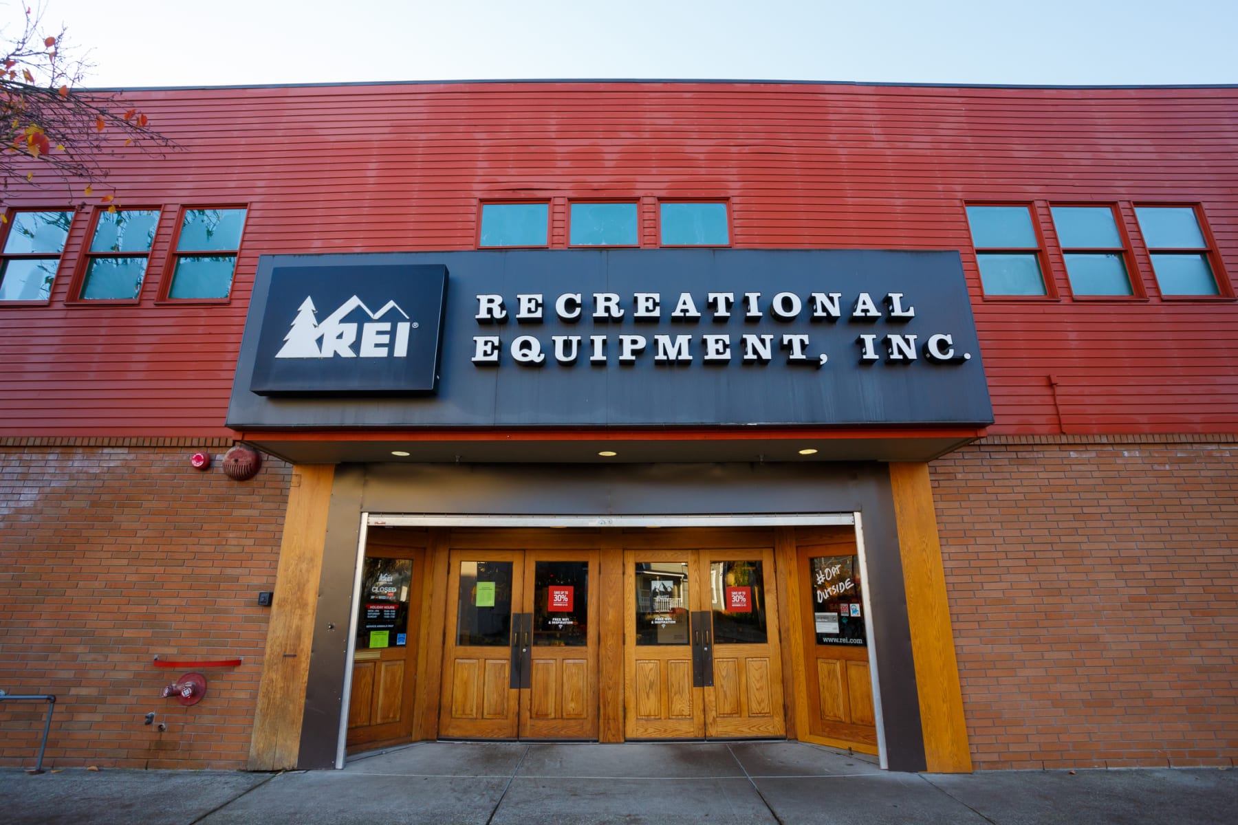 REI's storefront is displayed during the day.