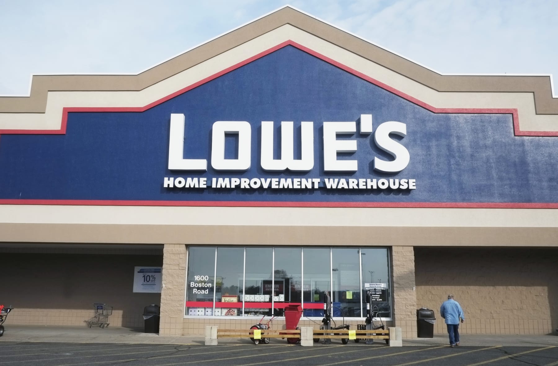 Man walks toward Lowe's store.