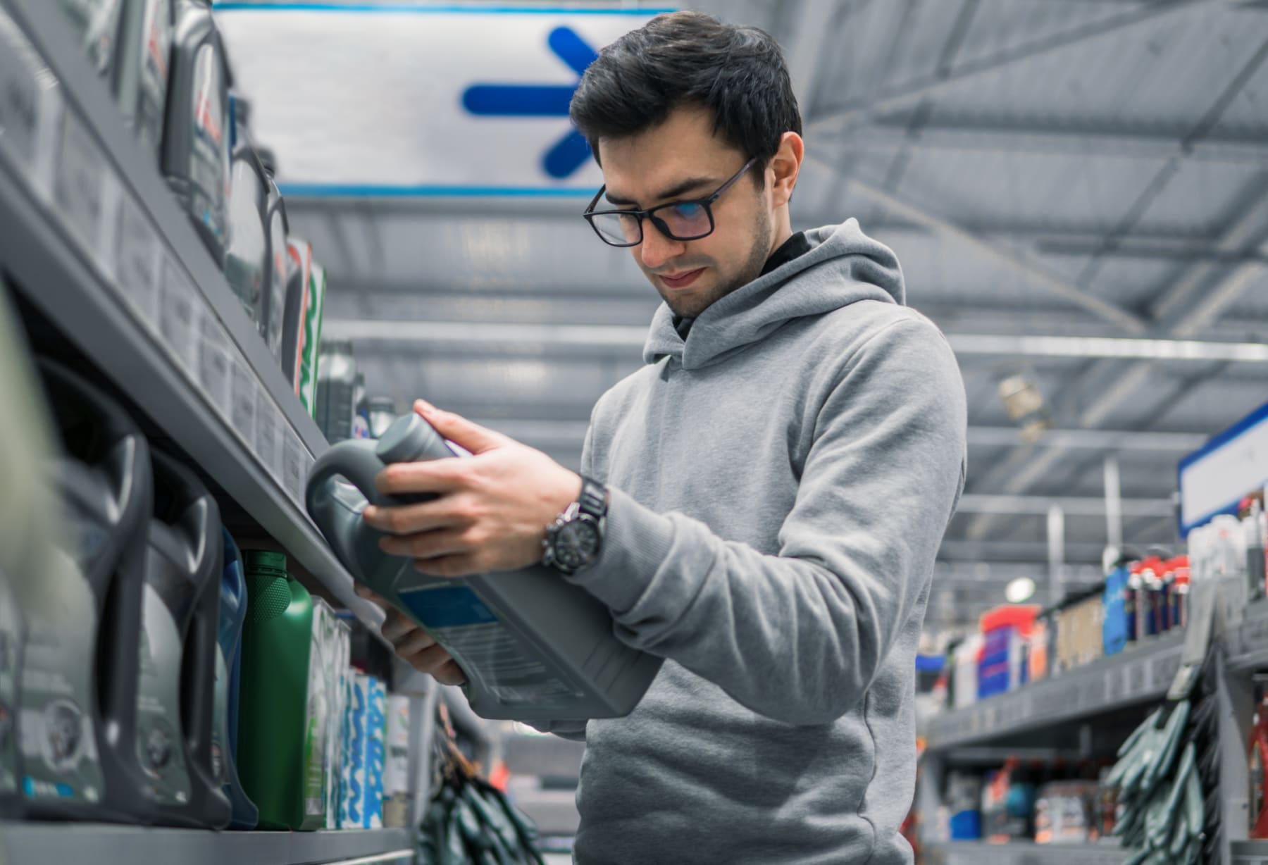 Man Buying Motor Oil