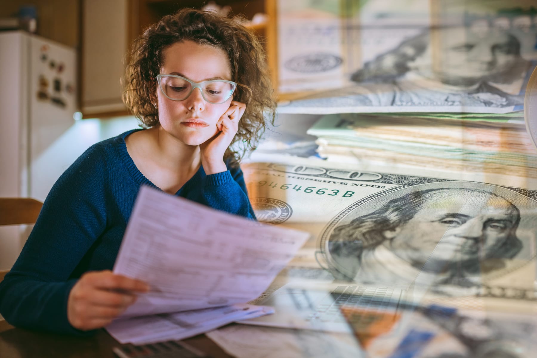woman paying bills thinking of cash