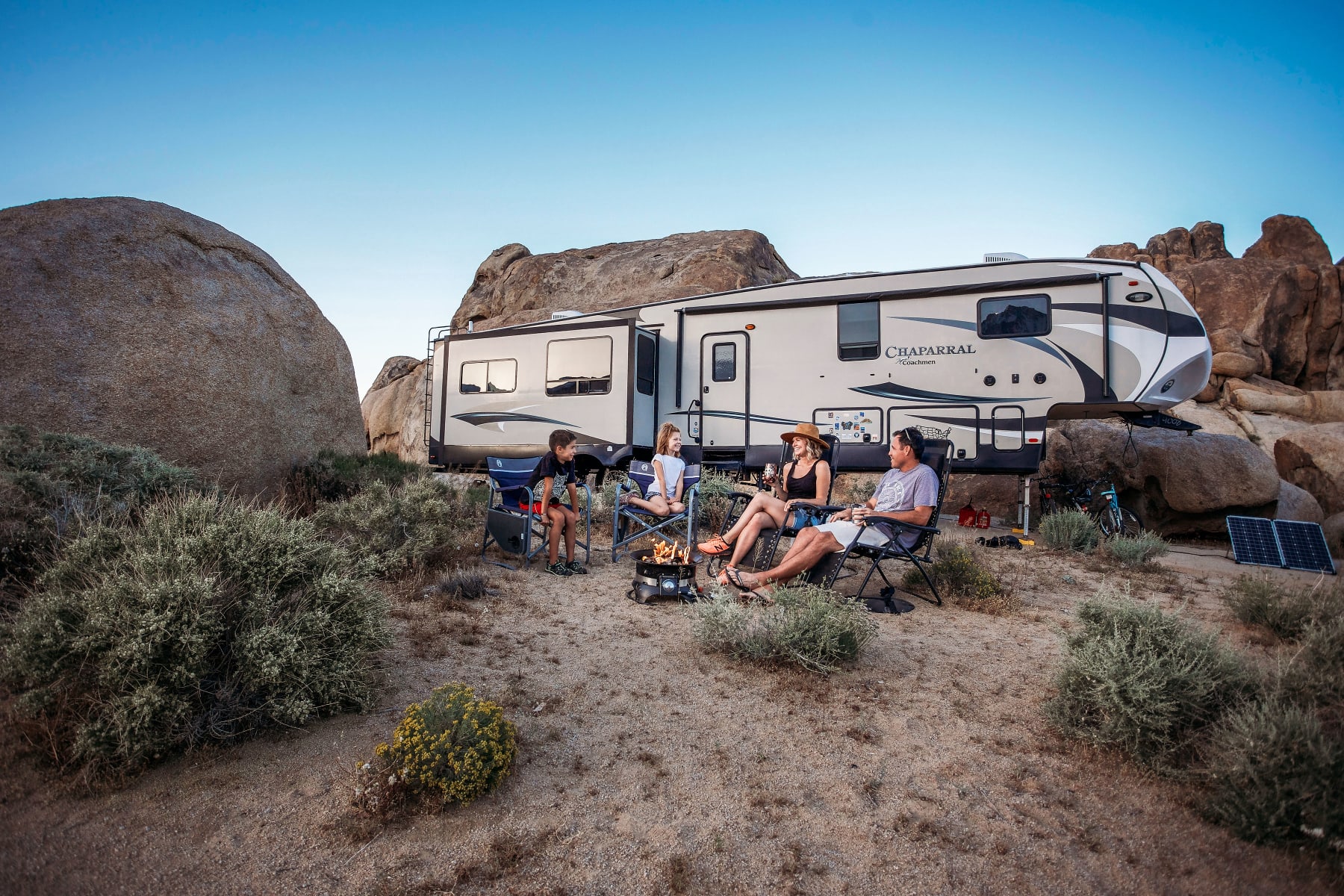 family in front of RV