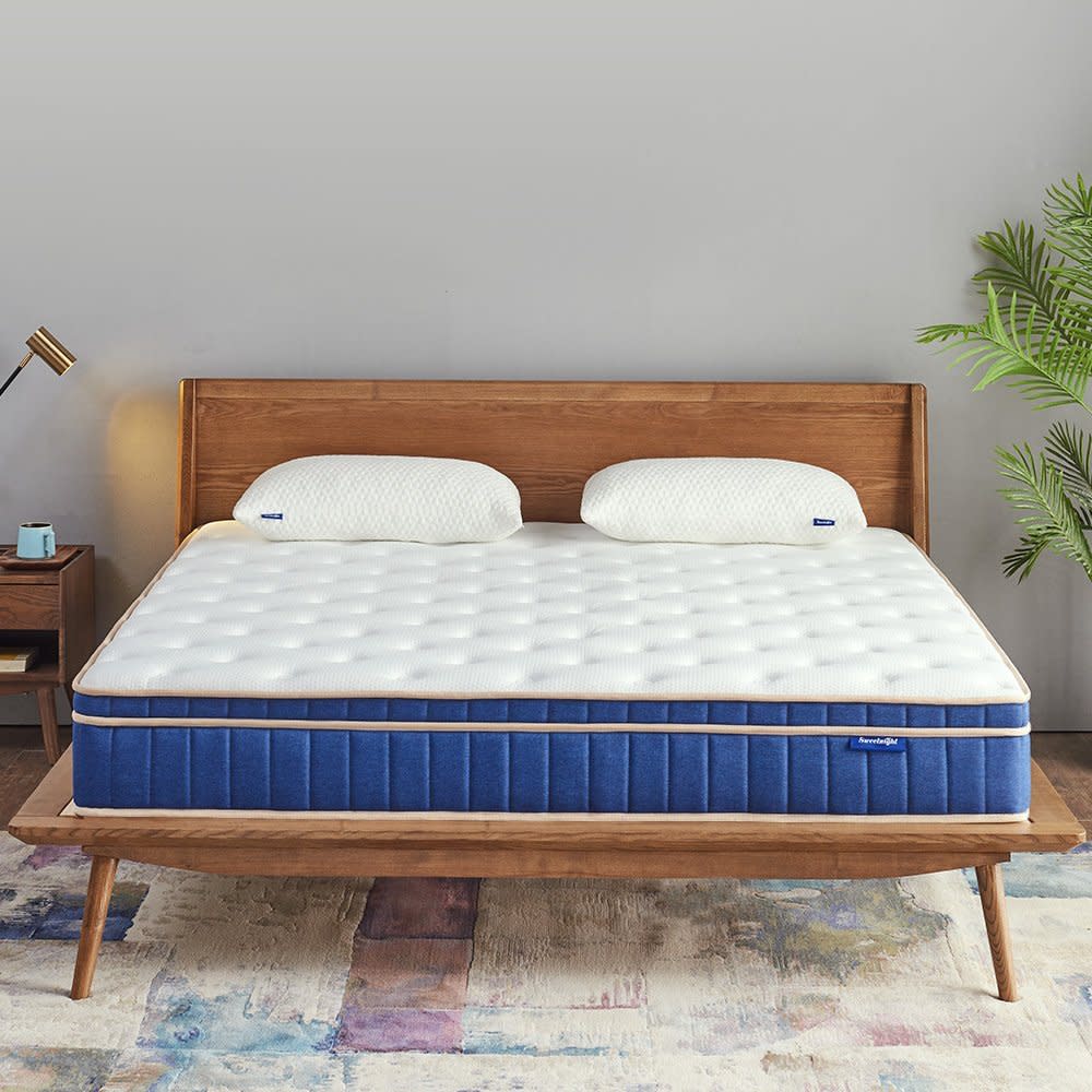 Wooden platform bed with bare mattress.