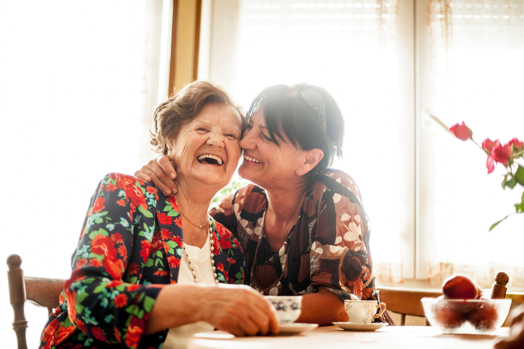 mom and daughter laughing
