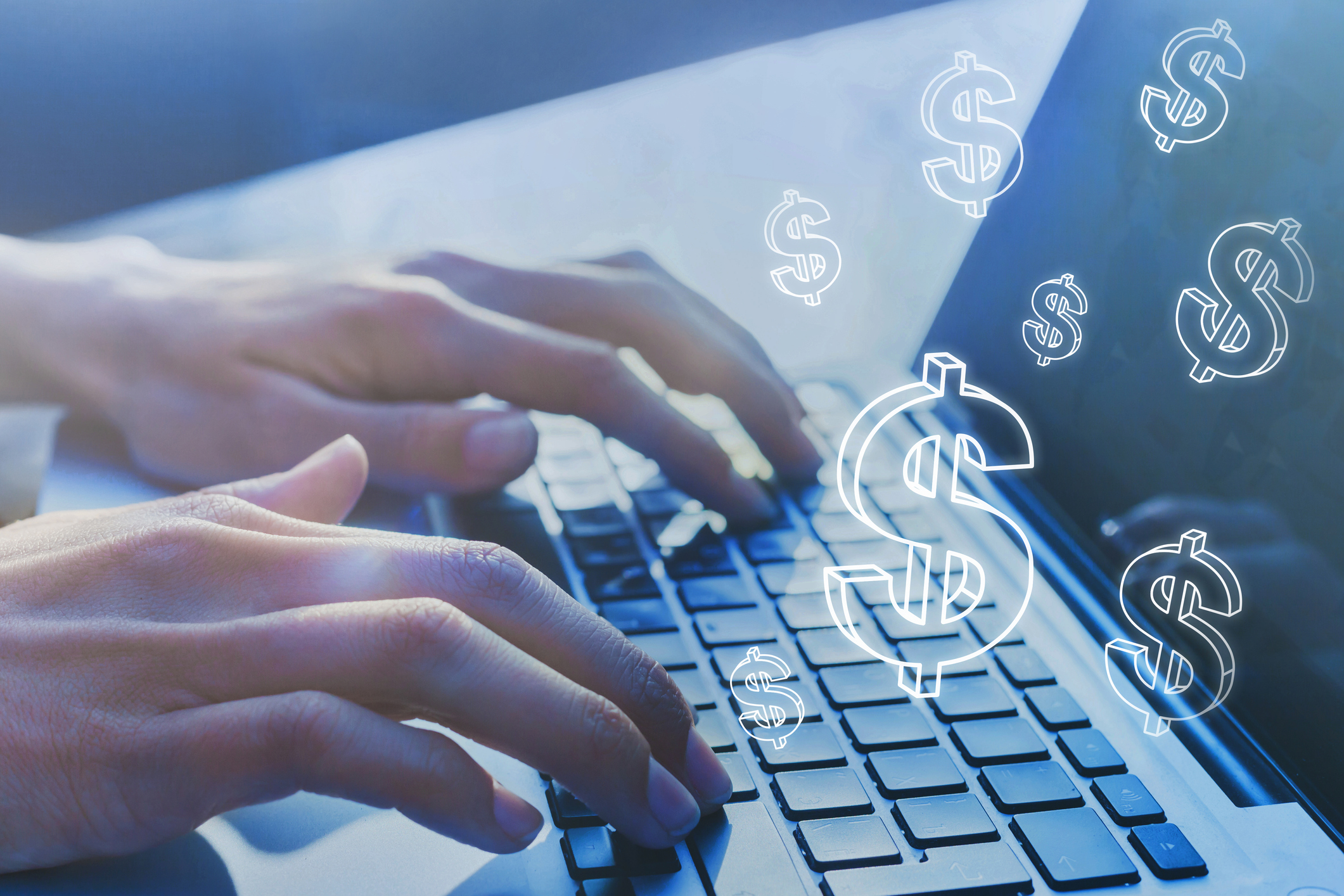 dollar signs around laptop